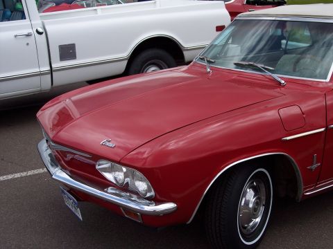 1972 Ford Ranchero - A red convertible, possibly a Corvair, is parked next to a white pickup truck.