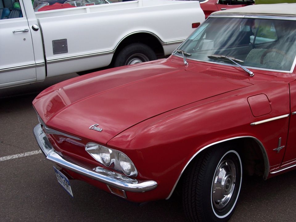 Red convertible front fender and hood with 'Corvair' script