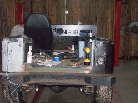 1978 Jeep CJ5 - This Jeep CJ5 is in a workshop, appearing to be undergoing some repairs or modifications.
