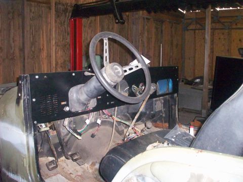 1978 Jeep CJ5 - The interior of a 1978 Jeep CJ5 is visible, with the dashboard and steering wheel prominent.