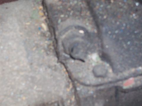1978 Jeep CJ5 - A close-up view of a dirty, dark mechanical component, possibly from a vehicle's drivetrain.