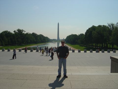 2001 Ford Crown Victoria - Man poses for a photo at the National Mall with the Washington Monument in the background.
