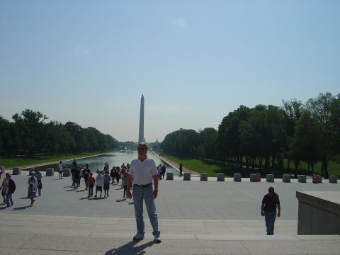2001 Ford Crown Victoria - A man stands on the steps of the Lincoln Memorial, with the Reflecting Pool and Washington Monument visible.