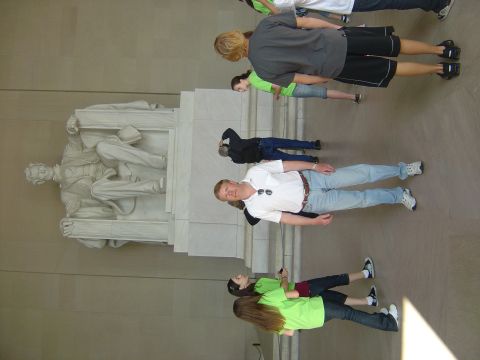 2001 Ford Crown Victoria - Tourists gather inside the Lincoln Memorial, observing the iconic statue of Abraham Lincoln.