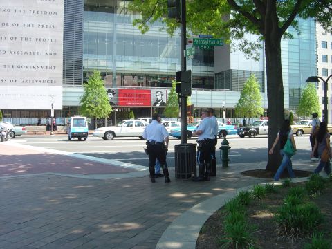 2001 Ford Crown Victoria - A white 2001 Ford Crown Victoria police car is seen parked on a street in Washington DC.