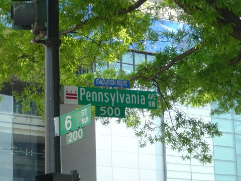 2001 Ford Crown Victoria - Street signs for Pennsylvania Ave NW 500 and 6th St NW 200 are visible under green trees.