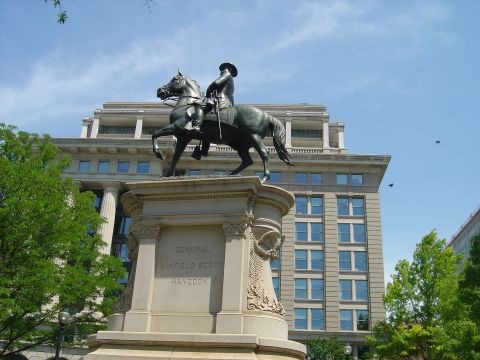 2001 Ford Crown Victoria - A statue of General Winfield Scott Hancock stands tall against a backdrop of a modern building and blue sky.