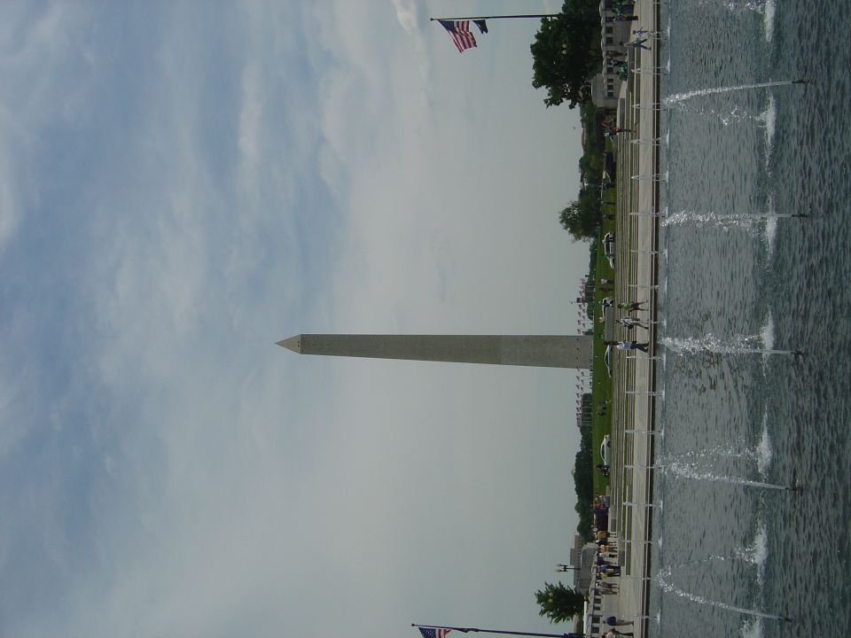 Washington Monument with fountains and American flags