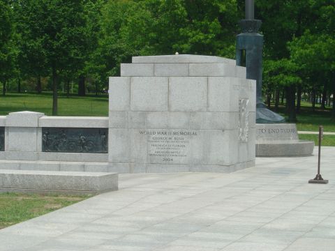 2001 Ford Crown Victoria - The World War II Memorial in Washington D.C. is shown with inscriptions detailing its dedication and completion.