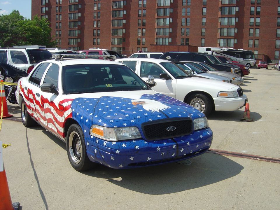 2001 Ford Crown Victoria police car with American flag and eagle graphics on hood and side