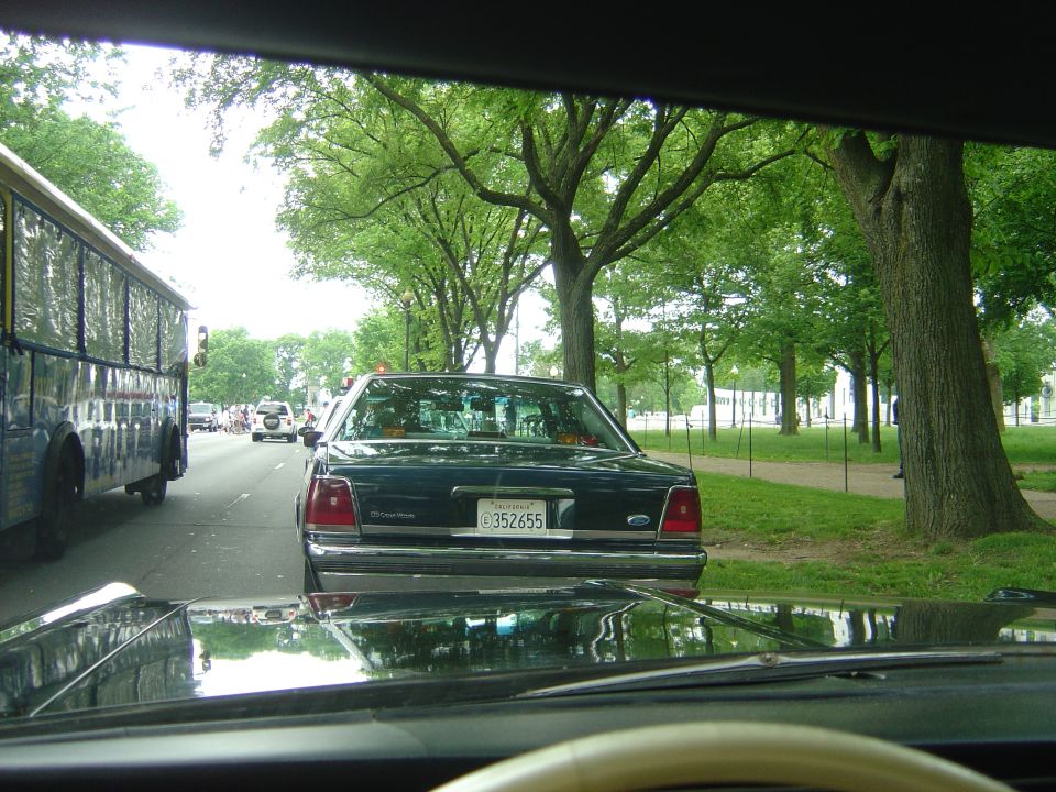 Dark 2001 Ford Crown Victoria rear view with license plate C352655