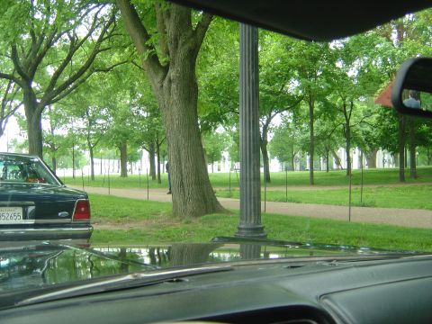 2001 Ford Crown Victoria - Rear view of a 2001 Ford Crown Victoria parked in a park setting.