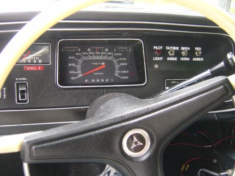 2001 Ford Crown Victoria - The dashboard features a speedometer, oil pressure gauge, and various control switches for lights and sirens.