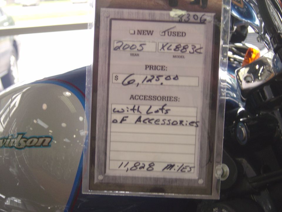 Motorcycle fuel tank with 'Davidson' logo and a price tag showing '2005' and '$6,125.00'
