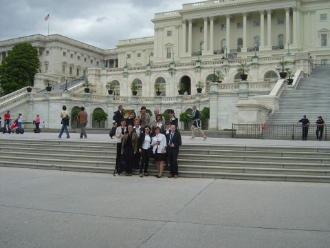 2001 Ford Crown Victoria - A group of people pose for a photo on the steps of a grand building.