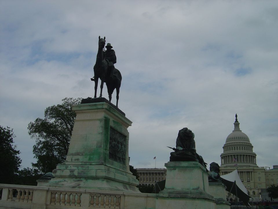Equestrian statue in foreground with US Capitol building in background