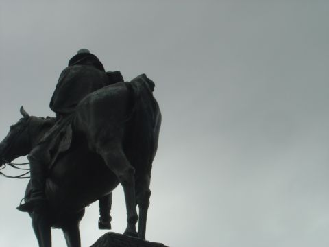 2001 Ford Crown Victoria - This statue depicts a figure on horseback, viewed from the rear against an overcast sky.
