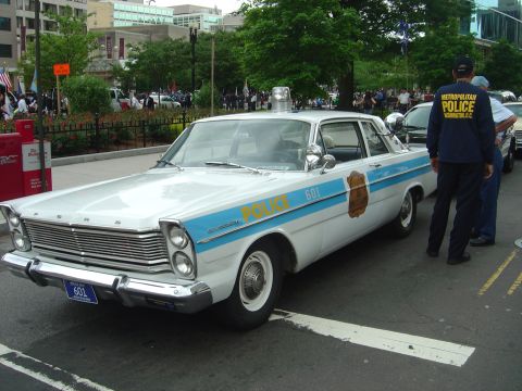 2001 Ford Crown Victoria - This vintage police car, likely a 1966 model, is marked with 'POLICE' and unit number 601.