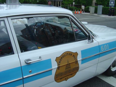2001 Ford Crown Victoria - Interior view of a vintage Metropolitan Police car, marked with '601'.