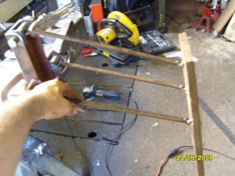 1989 Ford Bronco - Metal fabrication project in progress with various tools visible on the workbench.
