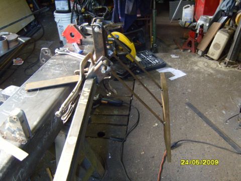 1989 Ford Bronco - A workshop setting shows metal fabrication in progress with various tools and materials visible date stamp.