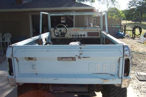 1976 Ford Bronco - This 1976 Ford Bronco is missing its top and doors, showing its interior and the Ford tailgate.