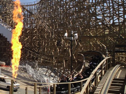1993 Ford Taurus - A roller coaster with a large flame effect on the left side of the track.
