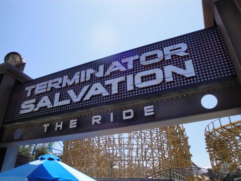 1993 Ford Taurus - Entrance sign for the Terminator Salvation The Ride attraction, with a roller coaster visible behind it.