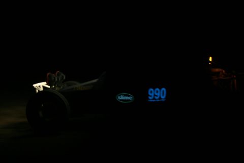 1996 Ford Bronco - A custom dragster with glowing blue numbers and a Slime logo is visible at night.