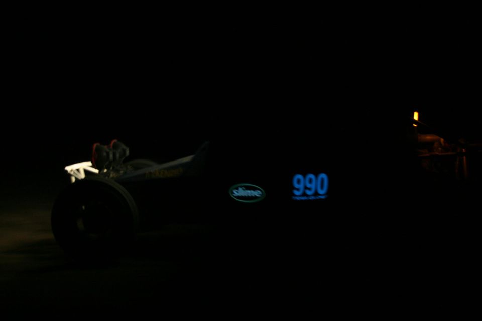Custom dragster with number 990 and Slime logo, at night