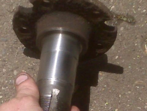 1995 Ford Bronco - A close-up shows a metal vehicle spindle with a Supermotors.net watermark at the bottom.