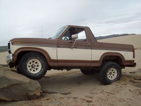 1985 Ford Bronco - This 1985 Ford Bronco is shown off-roading on sand dunes.