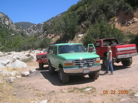 1985 Ford Bronco - Two Ford Broncos are parked on a dirt road in a mountainous area on May 22, 2009.