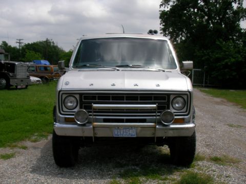 1978 Ford E250 - This van has a front-end brush guard and auxiliary lights mounted on the bumper.