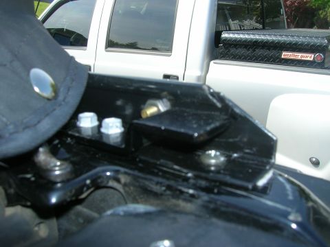 1996 Ford Bronco - Soft top hardware detail, with a Weather Guard toolbox visible on a white pickup truck.