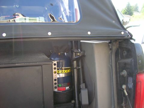 1996 Ford Bronco - A propane tank is secured inside the vehicle, near the rear passenger side.