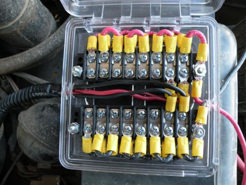1986 Ford Bronco - This is a close-up view of an automotive fuse box with many wires connected.
