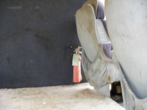1978 Ford E250 - A fire extinguisher is visible inside the vehicle, mounted on the wall near the seats.