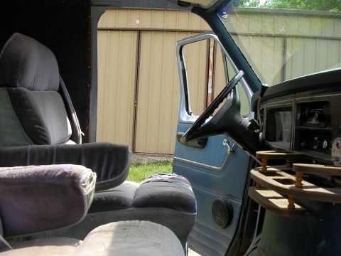 1978 Ford E250 - Interior view of a 1978 Ford E250 van, captain's chairs and the dashboard.