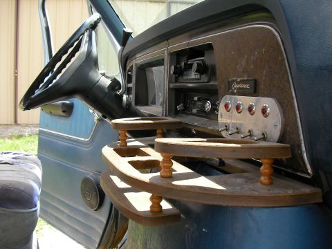 1978 Ford E250 - Custom wooden shelves and toggle switches are installed in the vehicle's interior.
