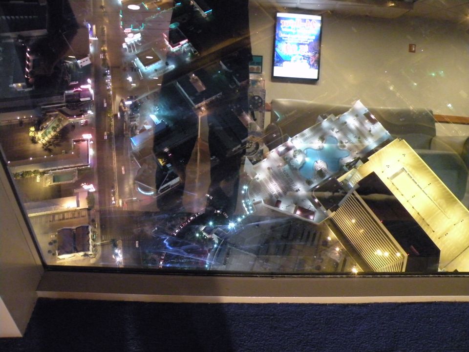 Aerial view of Las Vegas Strip at night with illuminated buildings and streetlights