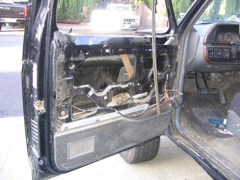 1989 Ford Bronco - Interior view of a 1989 Ford Bronco driver's door with the panel removed for repair.