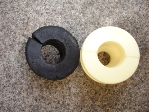 1993 Ford Taurus - Comparison of a worn-out rubber suspension bushing and a new polyurethane replacement.