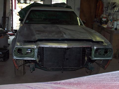 1975 Ford Ranchero - Front view of a 1975 Ford Ranchero undergoing restoration in a garage.