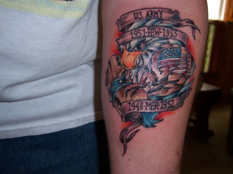 1996 Ford Bronco - A tattoo depicts an eagle clutching an American flag, surrounded by banners indicating U.S. Army service from 1951-1955 and 1948-1952.