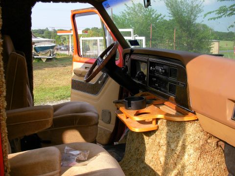1978 Ford E150 - Interior of a 1978 Ford E150 van, plush seating and a custom wooden console.
