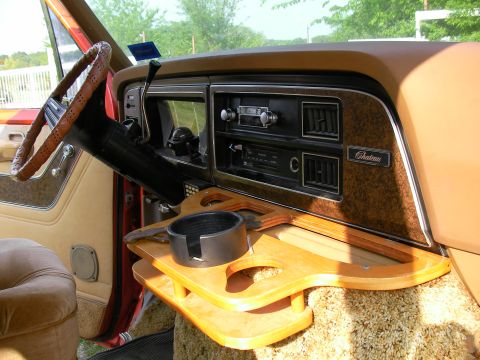 1978 Ford E150 - The dashboard features wood grain trim and a "Chateau" badge, indicating a specific trim level.