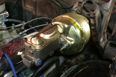 1967 Ford Galaxie - Close-up of a gold-colored brake booster and master cylinder assembly, likely a replacement part.
