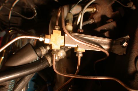 1967 Ford Galaxie - Close-up view of a brake line junction block and associated plumbing.