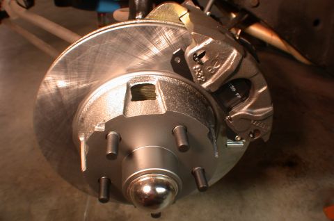 1967 Ford Galaxie - Disc brake assembly with rotor, caliper, and hub. Caliper shows part numbers.
